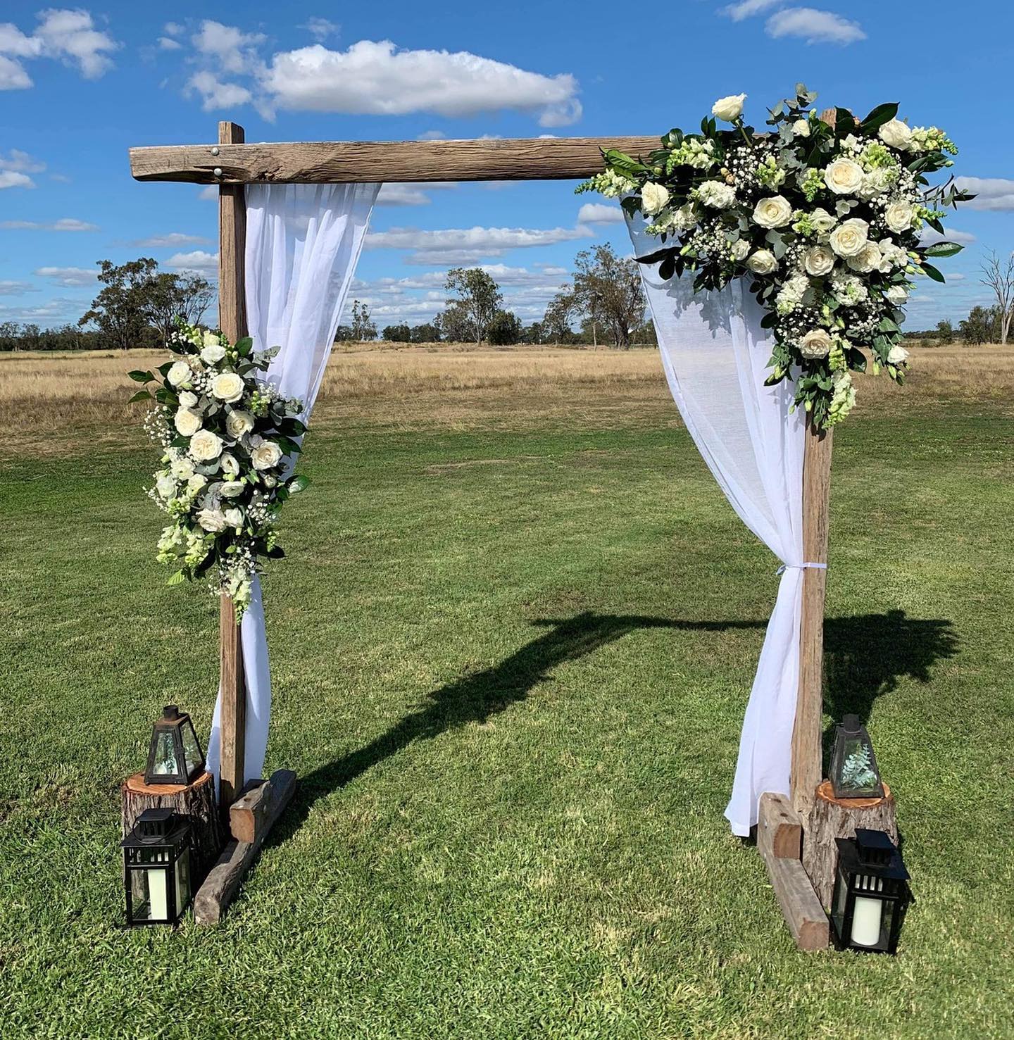 Wedding ceremony arch with flowers