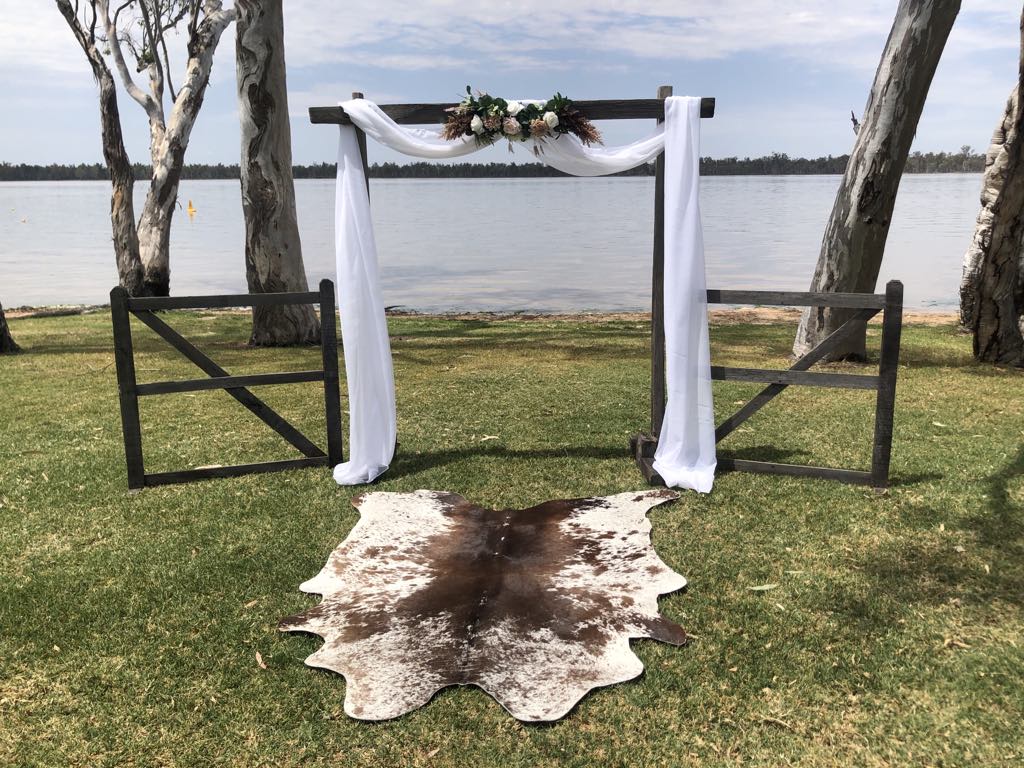 Wedding ceremony arch by the lake